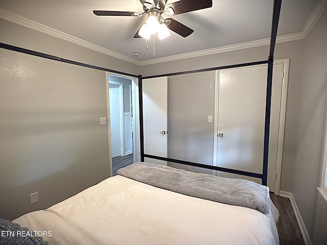 bedroom with hardwood / wood-style floors, ceiling fan, and ornamental molding