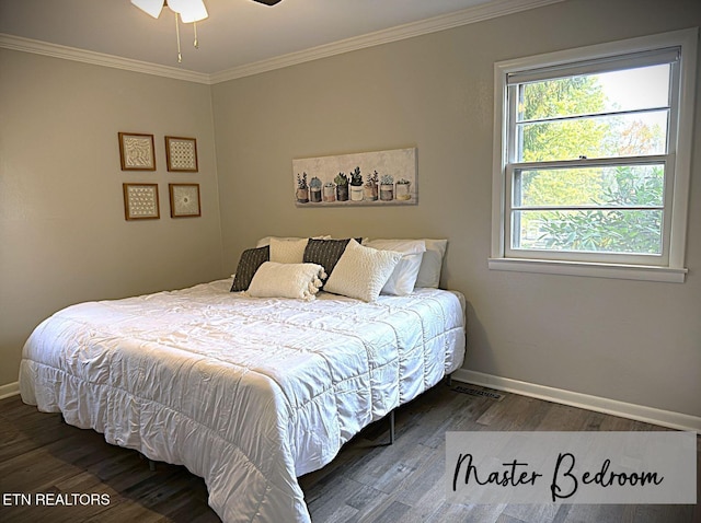 bedroom featuring hardwood / wood-style flooring, ceiling fan, and crown molding