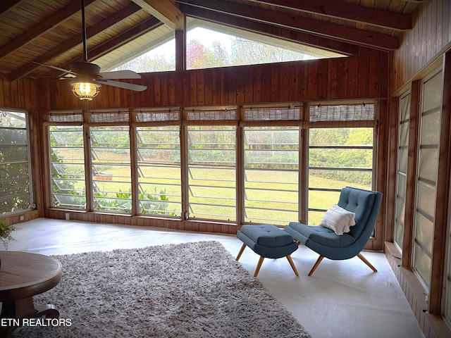 unfurnished sunroom featuring vaulted ceiling with beams, ceiling fan, and wood ceiling