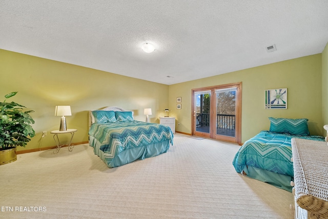 bedroom with light colored carpet, a textured ceiling, and access to outside