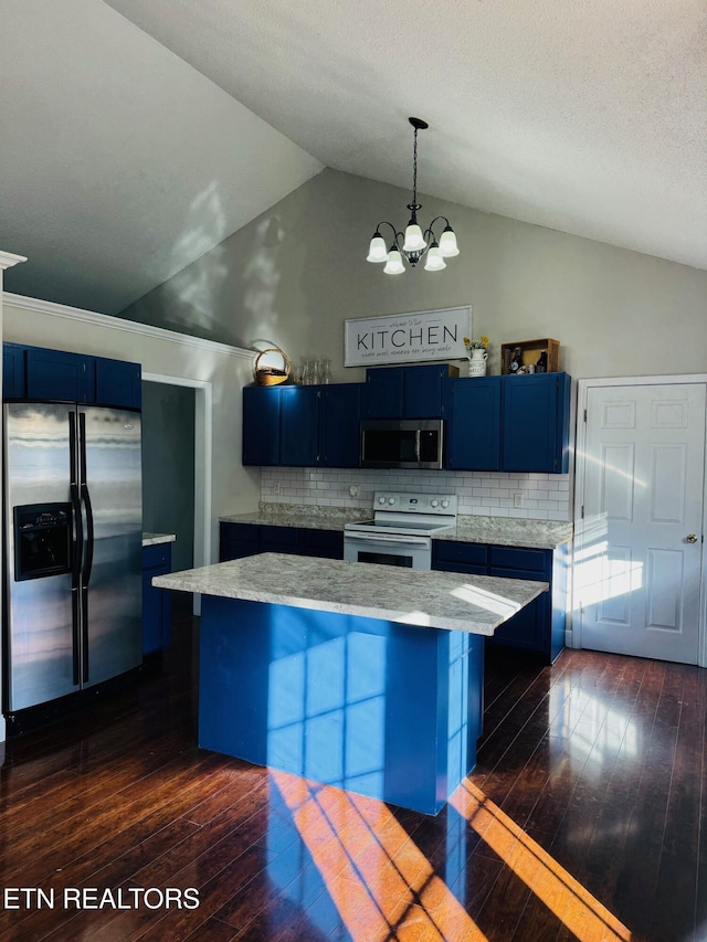 kitchen with dark hardwood / wood-style flooring, appliances with stainless steel finishes, hanging light fixtures, and blue cabinets