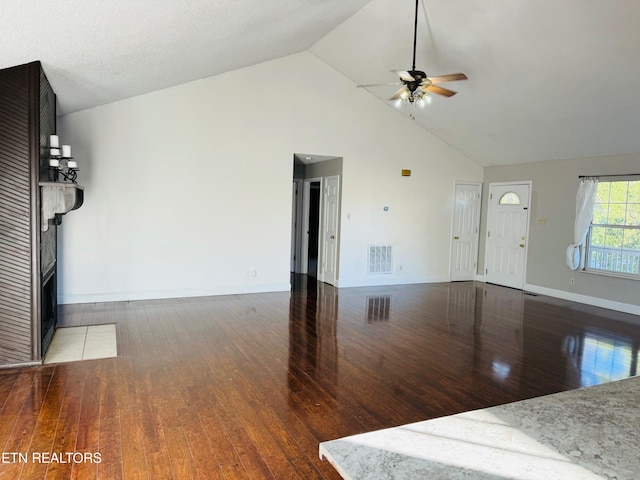 unfurnished living room featuring high vaulted ceiling, ceiling fan, and dark hardwood / wood-style floors