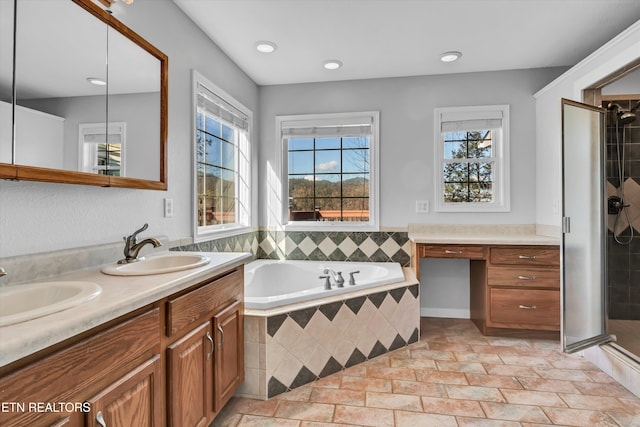 bathroom featuring a wealth of natural light, tile patterned flooring, vanity, and shower with separate bathtub