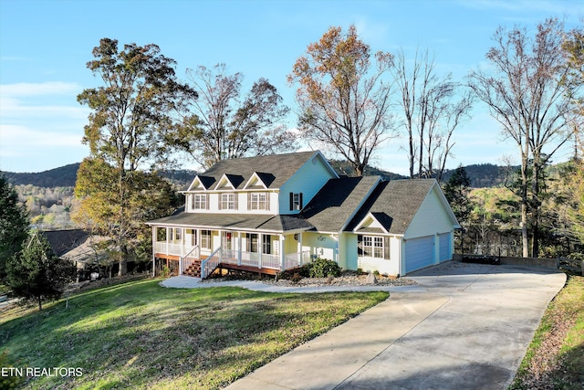 view of front facade with a mountain view, a porch, and a front lawn