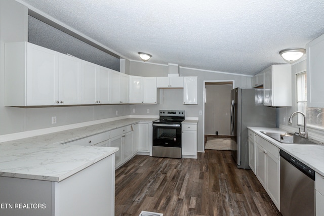 kitchen featuring white cabinets, dark hardwood / wood-style flooring, sink, and appliances with stainless steel finishes