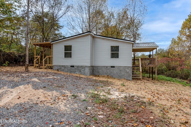 view of side of home featuring a porch