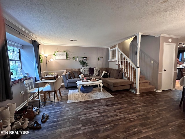 living room with a textured ceiling, dark hardwood / wood-style floors, and crown molding