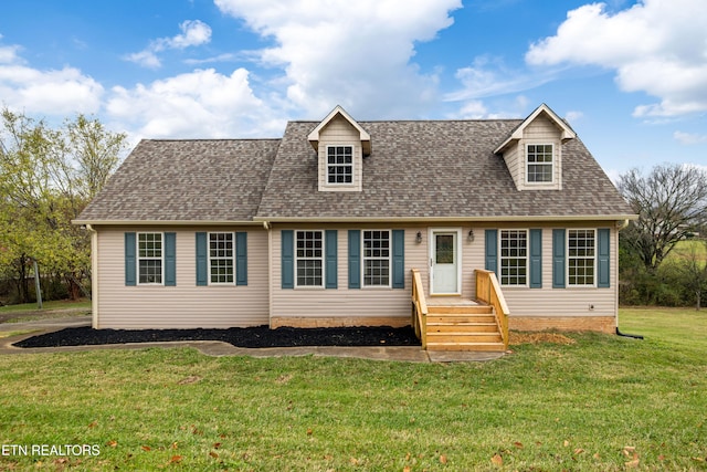 cape cod home with a front yard