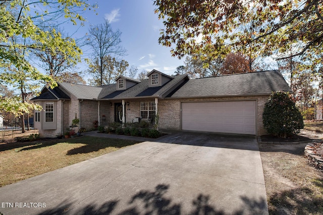 view of front facade with a garage and a front yard