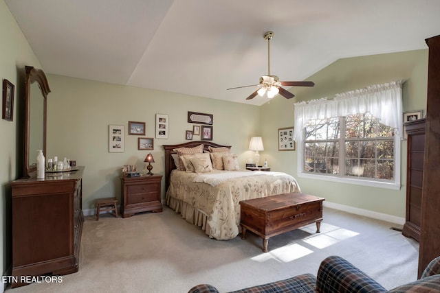 carpeted bedroom featuring ceiling fan and lofted ceiling