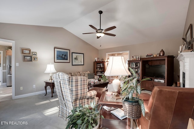 carpeted living room with ceiling fan and lofted ceiling