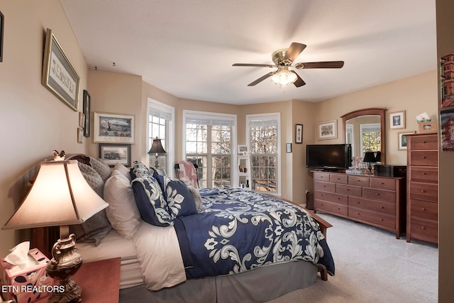 carpeted bedroom with ceiling fan