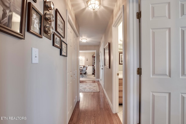 hall with light wood-type flooring