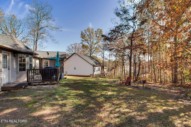 view of yard featuring a wooden deck