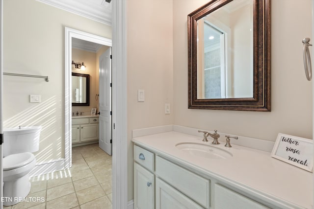 bathroom featuring vanity, toilet, crown molding, and tile patterned floors