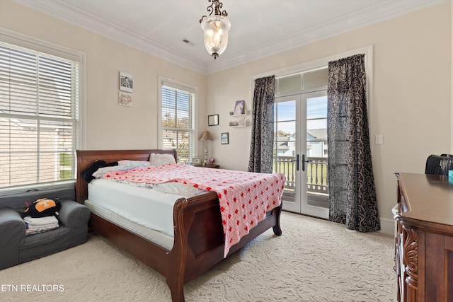 bedroom featuring french doors, carpet floors, access to outside, and multiple windows