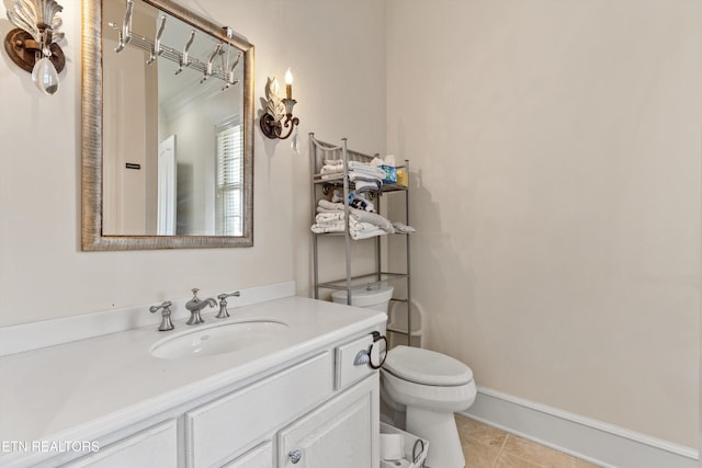 bathroom featuring vanity, toilet, and tile patterned floors