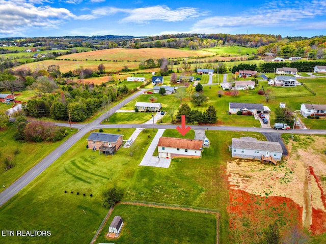 birds eye view of property featuring a rural view