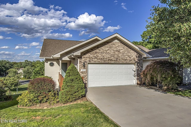 105 Poteau Trce, Loudon, TN 37774 - single story home featuring an attached garage, driveway, brick siding, and a shingled roof