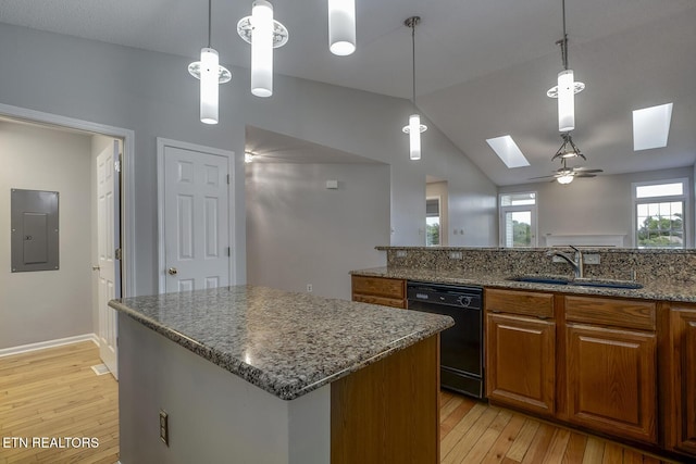 105 Poteau Trce, Loudon, TN 37774 - kitchen featuring black dishwasher, a skylight, a sink, electric panel, and light wood-type flooring