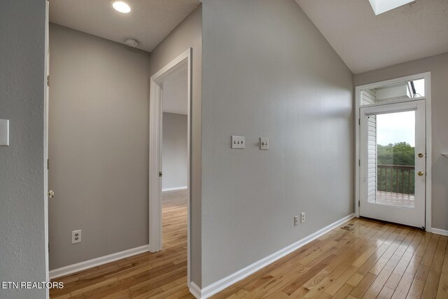 105 Poteau Trce, Loudon, TN 37774 - foyer entrance featuring light wood-type flooring, baseboards, a skylight, and lofted ceiling