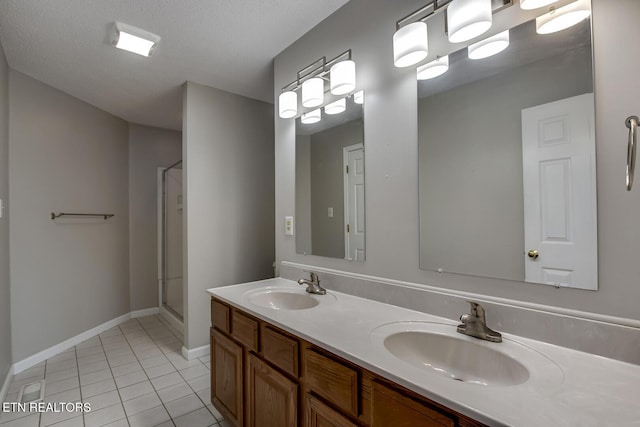 105 Poteau Trce, Loudon, TN 37774 - full bath with tile patterned floors, a shower stall, double vanity, and baseboards