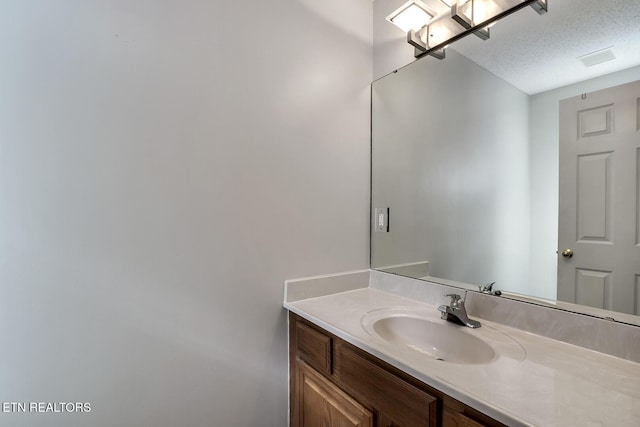 105 Poteau Trce, Loudon, TN 37774 - bathroom with vanity and a textured ceiling