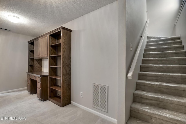 105 Poteau Trce, Loudon, TN 37774 - stairs with carpet flooring, a textured ceiling, and baseboards