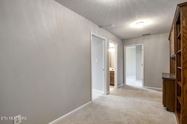 105 Poteau Trce, Loudon, TN 37774 - hall with light carpet, a textured ceiling, and baseboards