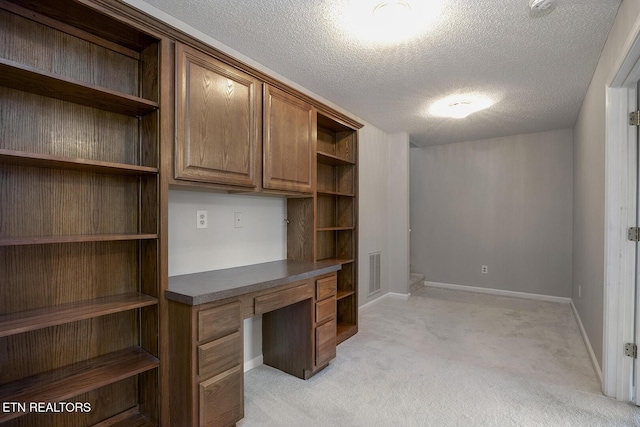 105 Poteau Trce, Loudon, TN 37774 - unfurnished office featuring built in desk, a textured ceiling, light carpet, and baseboards