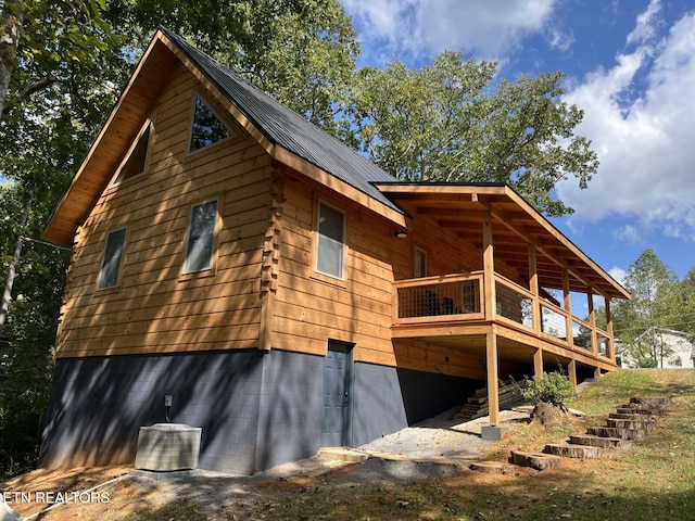 view of side of property featuring a deck