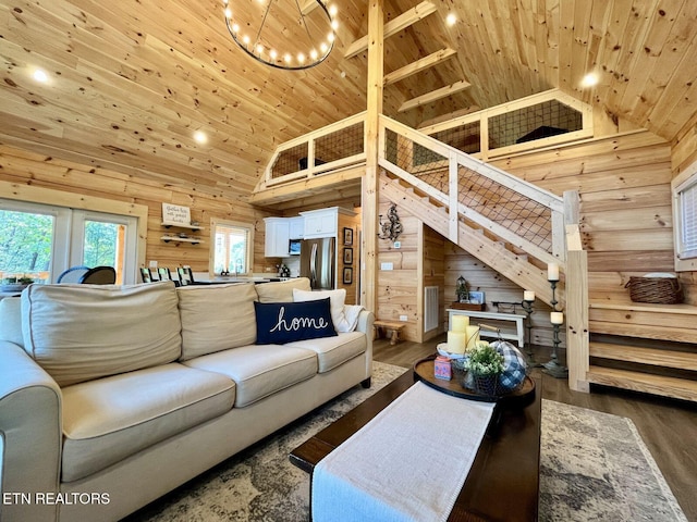 living room with wood walls, high vaulted ceiling, dark wood-type flooring, and wood ceiling