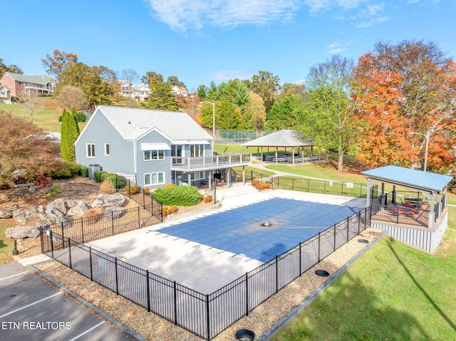 view of swimming pool featuring a yard and a patio