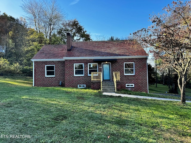 view of front of home with a front yard