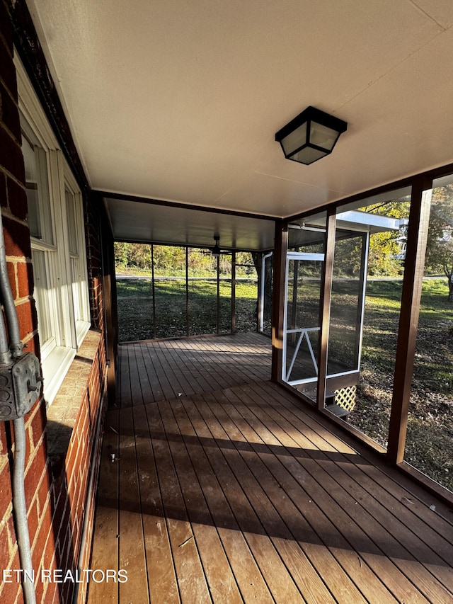 unfurnished sunroom featuring plenty of natural light