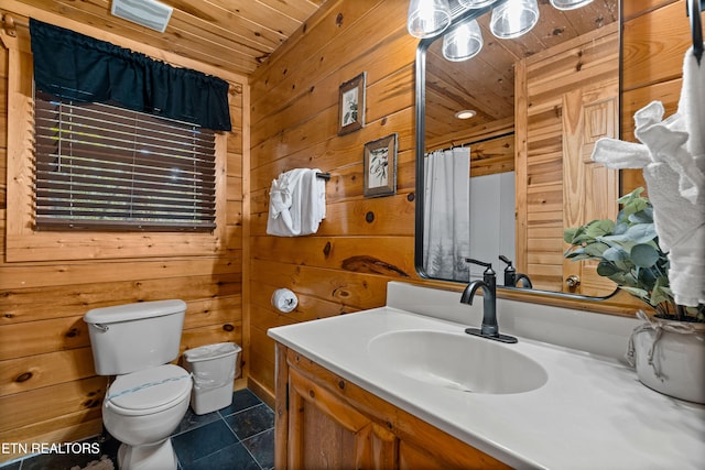 bathroom with wooden ceiling, wood walls, tile patterned flooring, vanity, and toilet