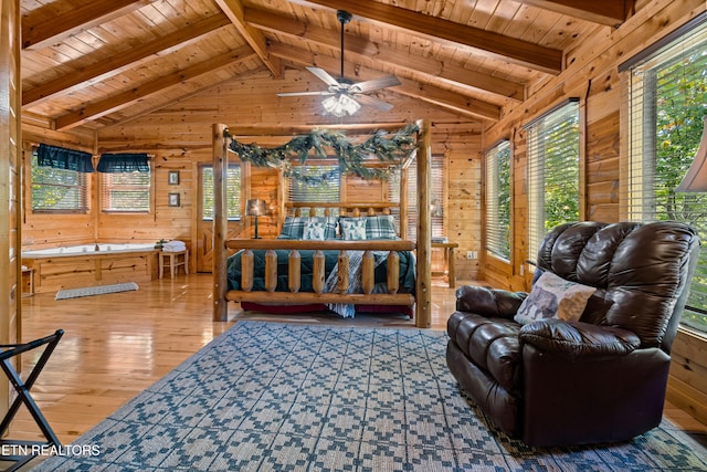 bedroom featuring wood walls, hardwood / wood-style flooring, wood ceiling, and vaulted ceiling with beams