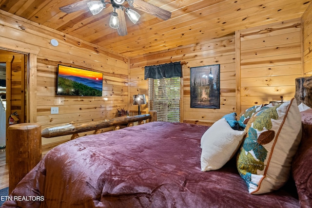 bedroom featuring wooden walls, ceiling fan, and wood ceiling