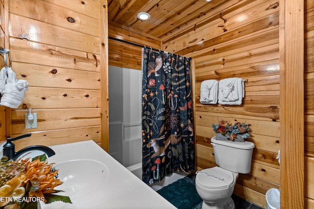 bathroom with toilet, wooden walls, a shower with shower curtain, and wooden ceiling