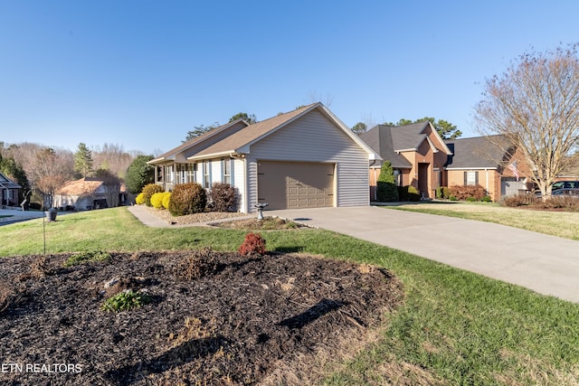 ranch-style home featuring a front yard and a garage