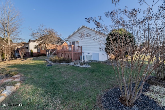 exterior space with a lawn and a wooden deck