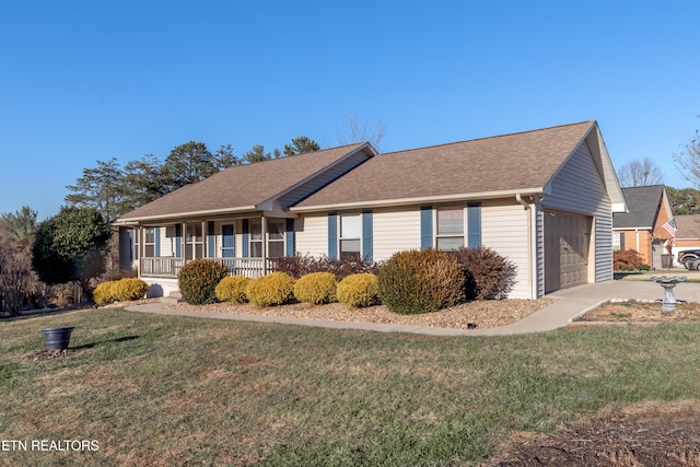 view of front of home with a front lawn, a porch, and a garage