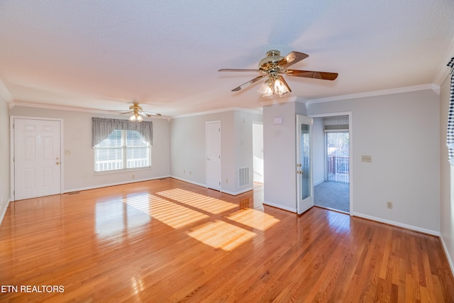 spare room with ceiling fan, ornamental molding, and light hardwood / wood-style flooring