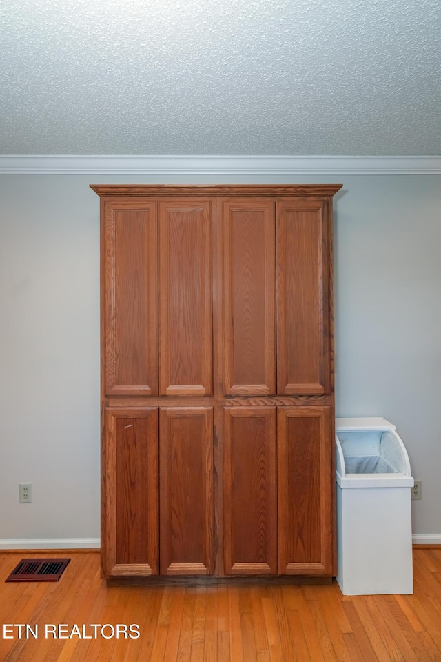 room details with hardwood / wood-style flooring and ornamental molding