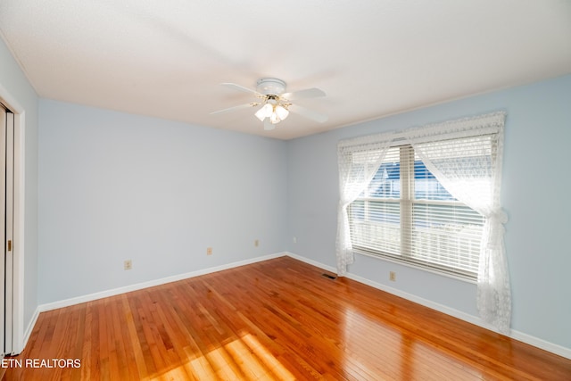 spare room featuring ceiling fan and wood-type flooring