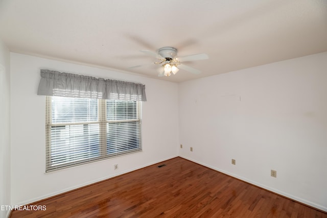 unfurnished room with hardwood / wood-style flooring and ceiling fan