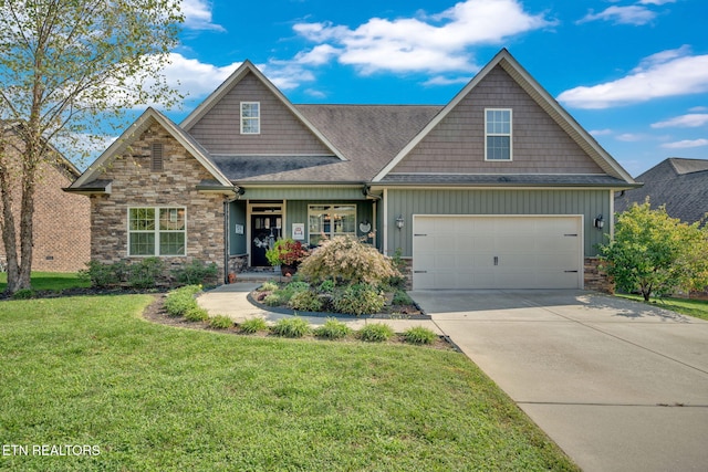 craftsman-style house featuring a front yard and a garage