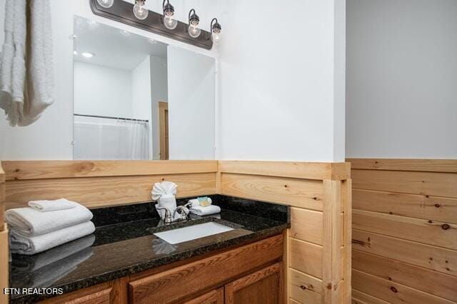 bathroom with vanity and a shower with shower curtain