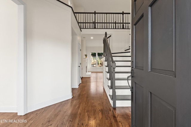 foyer entrance with dark hardwood / wood-style flooring