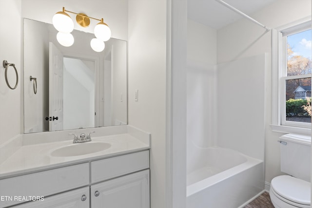 full bathroom with vanity,  shower combination, and toilet